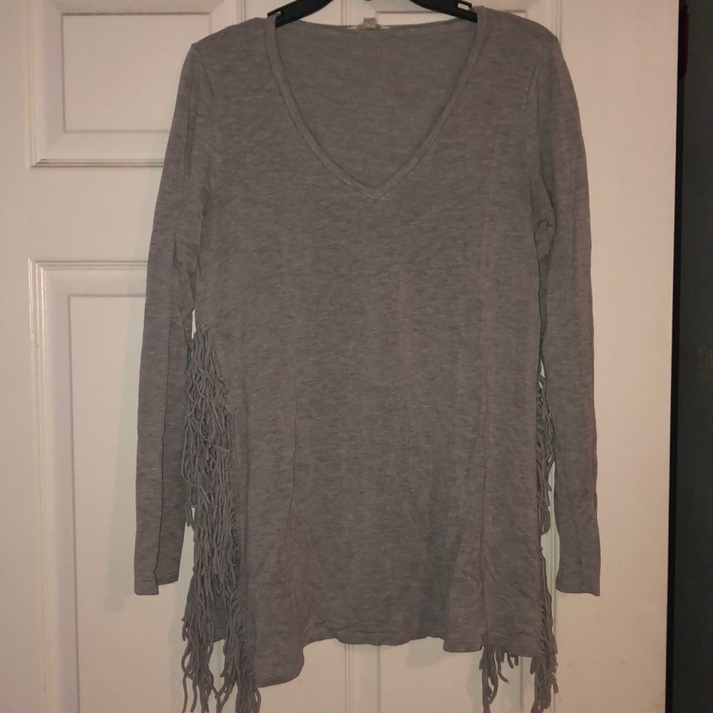 Cotton long sleeve top with fringe detail.